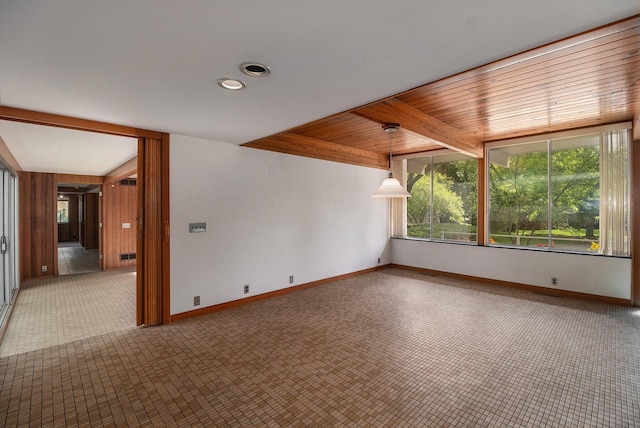 19 Heatheridge St, Ann Arbor, MI 48104 - unfurnished room featuring baseboards, carpet flooring, recessed lighting, and wood ceiling with exposed beams