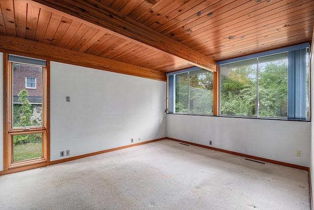 19 Heatheridge St, Ann Arbor, MI 48104 - carpeted empty room featuring baseboards and wood ceiling with exposed beams