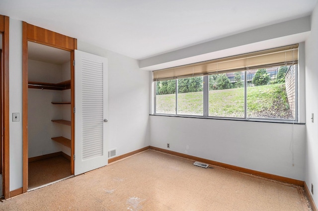 19 Heatheridge St, Ann Arbor, MI 48104 - unfurnished bedroom with a closet, light floors, and baseboards