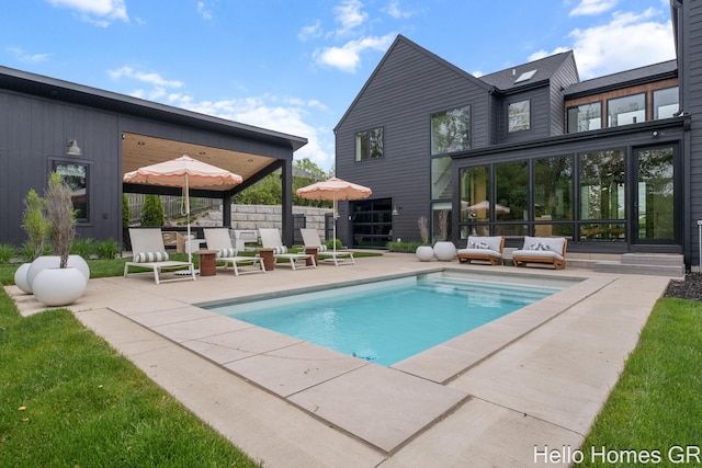 421 Manhattan Rd SE, Grand Rapids, MI 49506 - swimming pool featuring a patio and an outdoor living space