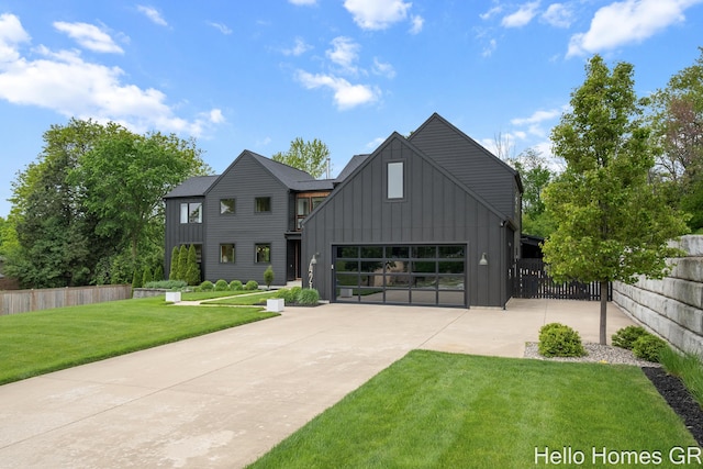 421 Manhattan Rd SE, Grand Rapids, MI 49506 - modern farmhouse with board and batten siding, concrete driveway, and a garage