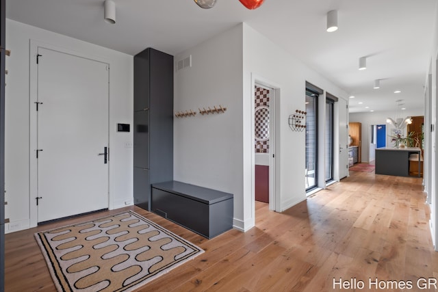 421 Manhattan Rd SE, Grand Rapids, MI 49506 - foyer with light wood finished floors, recessed lighting, and baseboards