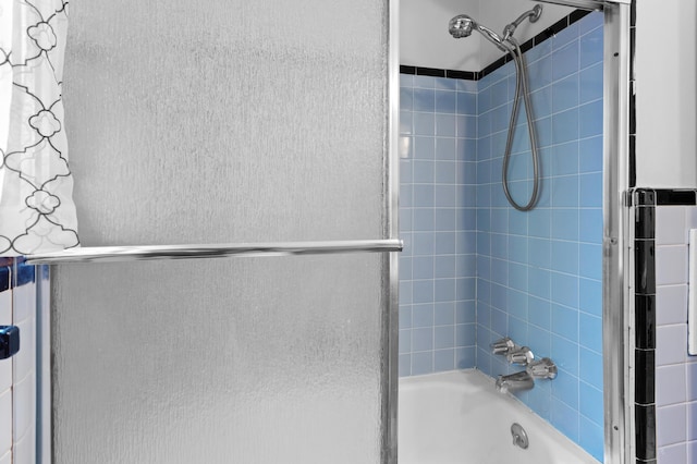 9085 Brentwood St, Livonia, MI 48150 - bathroom featuring shower / bath combination with glass door