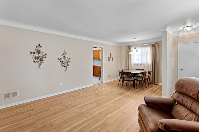 9085 Brentwood St, Livonia, MI 48150 - living room with light wood-style flooring and baseboards