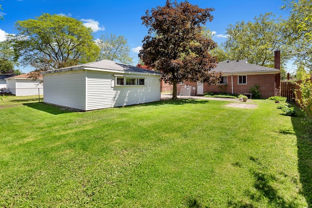 9085 Brentwood St, Livonia, MI 48150 - back of property with an outbuilding and a chimney