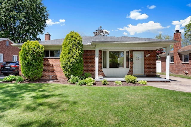 9085 Brentwood St, Livonia, MI 48150 - view of front of home featuring a chimney, brick siding, a front yard, and a porch