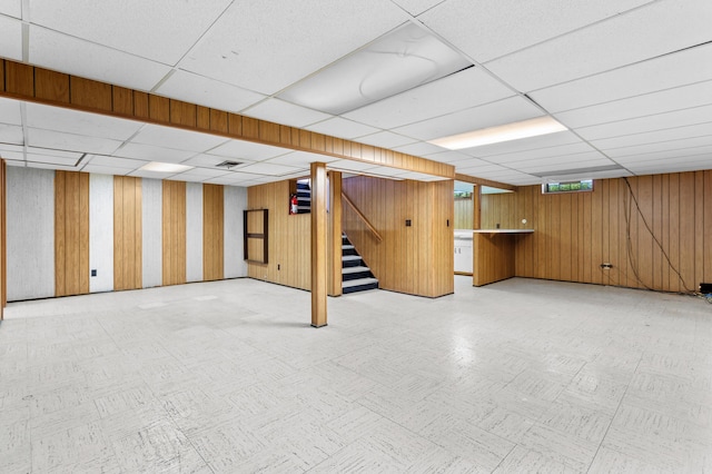 9085 Brentwood St, Livonia, MI 48150 - finished basement featuring a paneled ceiling, stairway, and wooden walls