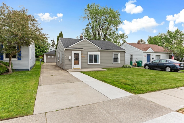 28506 Donnelly St, Garden City, MI 48135 - view of front of home with a front lawn, a shingled roof, and a chimney