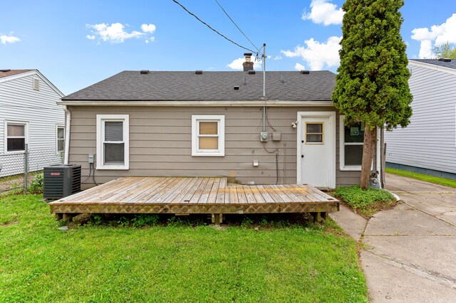 28506 Donnelly St, Garden City, MI 48135 - rear view of house featuring cooling unit, a yard, roof with shingles, a deck, and a chimney