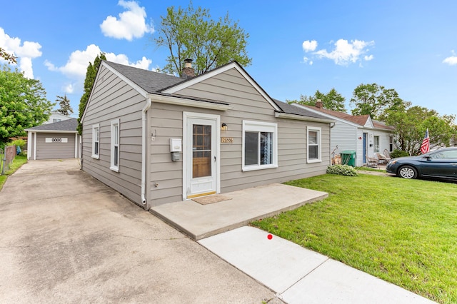 28506 Donnelly St, Garden City, MI 48135 - view of front facade featuring a front lawn, a chimney, a garage, and a shingled roof