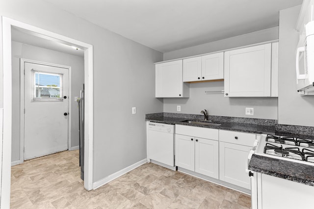 28506 Donnelly St, Garden City, MI 48135 - kitchen featuring white appliances, a sink, white cabinetry, and dark stone counters