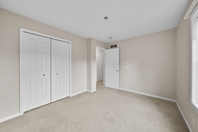 10639 Hanover Rd, Hanover, MI 49241 - unfurnished bedroom with light carpet, baseboards, and a closet