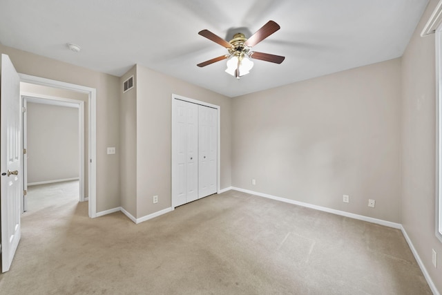 10639 Hanover Rd, Hanover, MI 49241 - unfurnished bedroom with light carpet, baseboards, a closet, and a ceiling fan