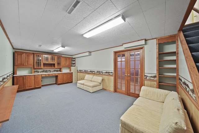 10639 Hanover Rd, Hanover, MI 49241 - living room with french doors, a wainscoted wall, carpet floors, stairway, and wood walls