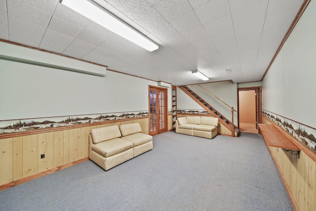 10639 Hanover Rd, Hanover, MI 49241 - unfurnished room featuring stairs, carpet, wainscoting, french doors, and wooden walls