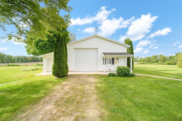 10639 Hanover Rd, Hanover, MI 49241 - view of front facade with a front lawn, an outdoor structure, and a garage