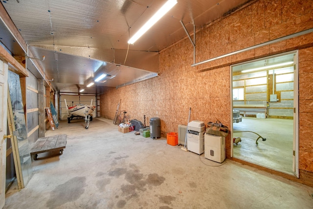10639 Hanover Rd, Hanover, MI 49241 - below grade area featuring a garage and radiator heating unit