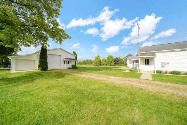 10639 Hanover Rd, Hanover, MI 49241 - view of grassy yard with a detached garage and driveway