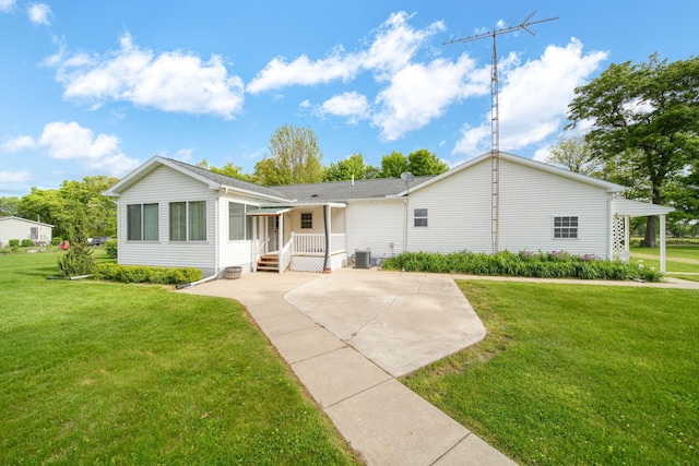 10639 Hanover Rd, Hanover, MI 49241 - ranch-style house with a front yard, central AC, and a patio