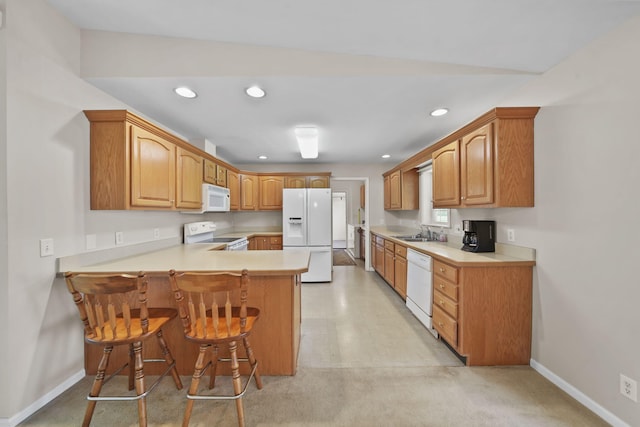 10639 Hanover Rd, Hanover, MI 49241 - kitchen featuring white appliances, a peninsula, a sink, recessed lighting, and baseboards