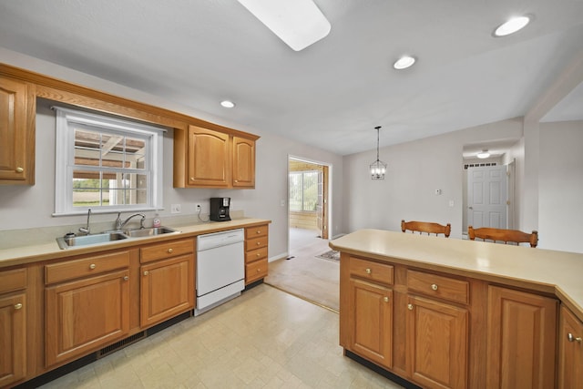 10639 Hanover Rd, Hanover, MI 49241 - kitchen with white dishwasher, a sink, light countertops, hanging light fixtures, and recessed lighting
