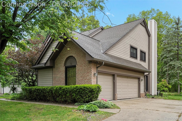2640 Water Oaks Dr, West Bloomfield, MI 48324 - view of front of home with brick siding, a shingled roof, concrete driveway, a garage, and a chimney
