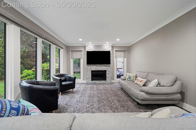 2640 Water Oaks Dr, West Bloomfield, MI 48324 - living area with ornamental molding, a fireplace, recessed lighting, and baseboards