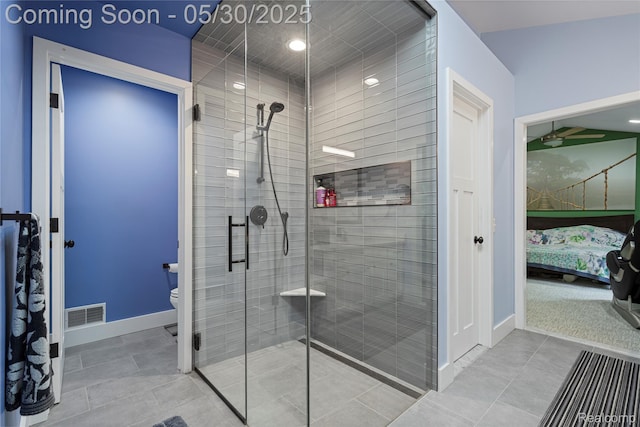 2640 Water Oaks Dr, West Bloomfield, MI 48324 - bathroom with ensuite bathroom, a stall shower, baseboards, toilet, and tile patterned floors