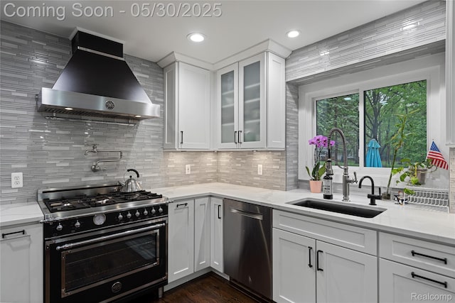 2640 Water Oaks Dr, West Bloomfield, MI 48324 - kitchen featuring gas range, stainless steel dishwasher, ventilation hood, a sink, and backsplash