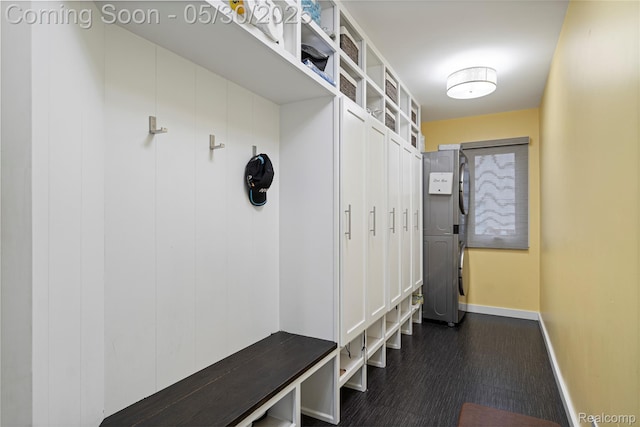 2640 Water Oaks Dr, West Bloomfield, MI 48324 - mudroom with baseboards and stacked washing machine and dryer