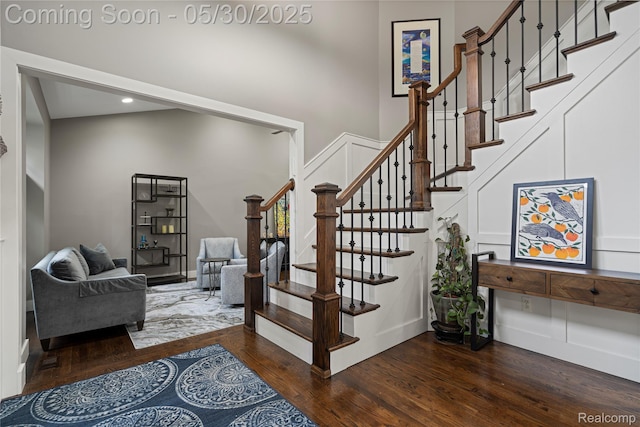 2640 Water Oaks Dr, West Bloomfield, MI 48324 - stairway featuring wood finished floors, a towering ceiling, and recessed lighting