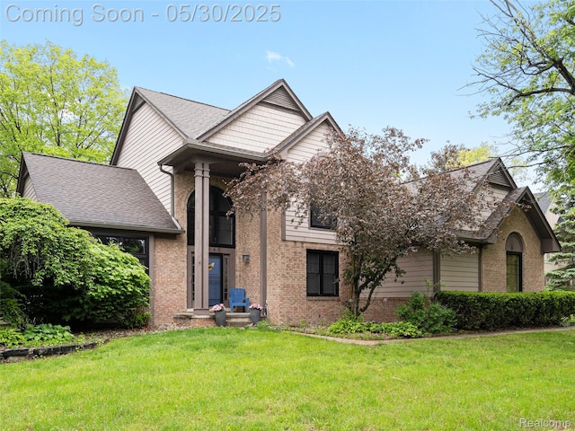 2640 Water Oaks Dr, West Bloomfield, MI 48324 - view of front of property with brick siding and a front yard