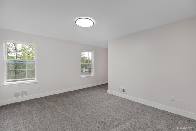 6080 Beniteau St, Detroit, MI 48213 - empty room with baseboards and carpet flooring