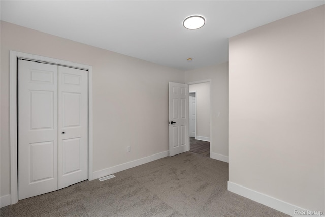 6080 Beniteau St, Detroit, MI 48213 - unfurnished bedroom with carpet, baseboards, and a closet