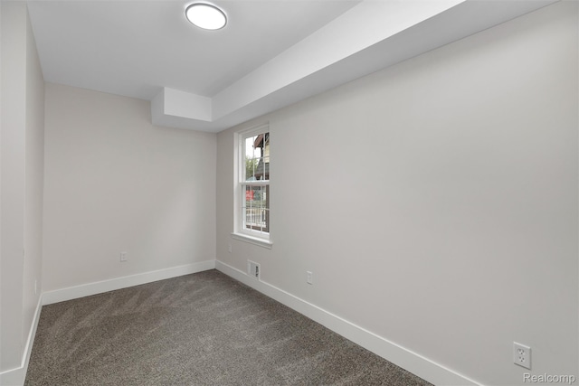 6080 Beniteau St, Detroit, MI 48213 - spare room featuring dark colored carpet and baseboards