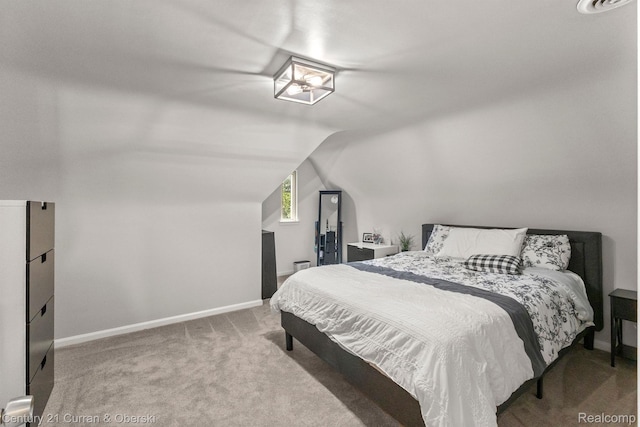 21975 Wildwood St, Dearborn, MI 48128 - carpeted bedroom with lofted ceiling and baseboards