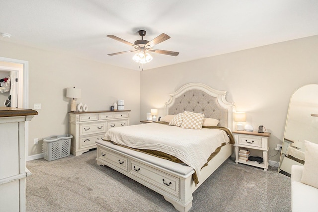 631 N Hilton Park Rd, Muskegon, MI 49442 - bedroom with light colored carpet, a ceiling fan, and baseboards