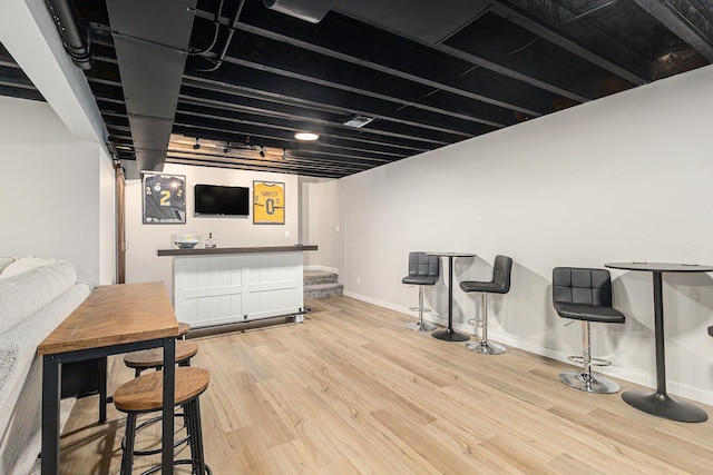 631 N Hilton Park Rd, Muskegon, MI 49442 - indoor wet bar with light wood-style floors and baseboards