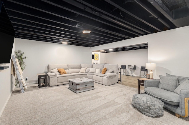 631 N Hilton Park Rd, Muskegon, MI 49442 - carpeted living room featuring baseboards