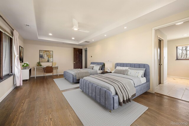1000 Forest Ln, Bloomfield Hills, MI 48301 - bedroom with recessed lighting, a raised ceiling, a ceiling fan, baseboards, and wood finished floors