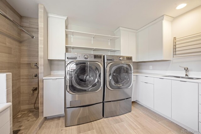 1000 Forest Ln, Bloomfield Hills, MI 48301 - laundry area with separate washer and dryer, light wood-style floors, recessed lighting, and cabinet space