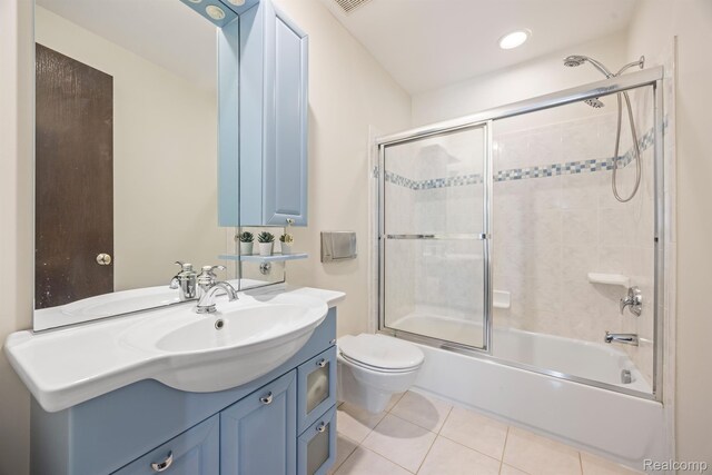 1000 Forest Ln, Bloomfield Hills, MI 48301 - bathroom featuring toilet, tile patterned flooring, vanity, and combined bath / shower with glass door