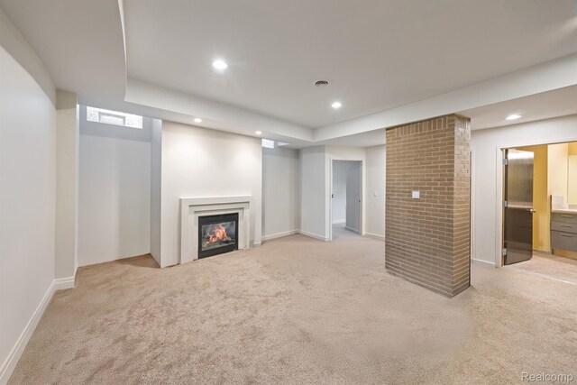 1000 Forest Ln, Bloomfield Hills, MI 48301 - unfurnished living room featuring light carpet, a glass covered fireplace, recessed lighting, baseboards, and a raised ceiling