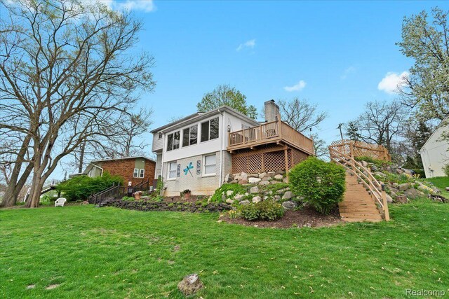 1425 Shankin Dr, Wolverine Lake, MI 48390 - rear view of property featuring a yard, a chimney, a deck, and stairway