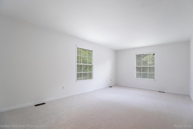 164 Barrington Cir, Lake Orion, MI 48360 - empty room featuring light carpet and baseboards
