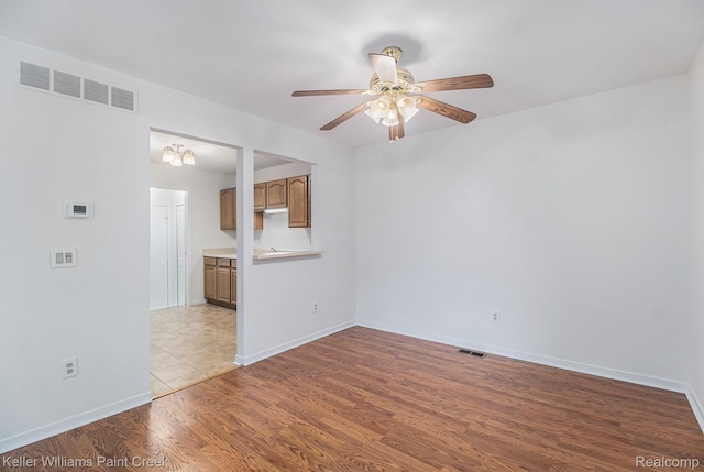 164 Barrington Cir, Lake Orion, MI 48360 - unfurnished room with a ceiling fan, wood finished floors, and baseboards