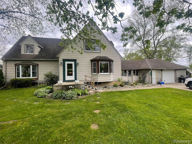 1264 Brabbs St, Burton, MI 48509 - view of front facade featuring a garage, a front yard, a shingled roof, and driveway
