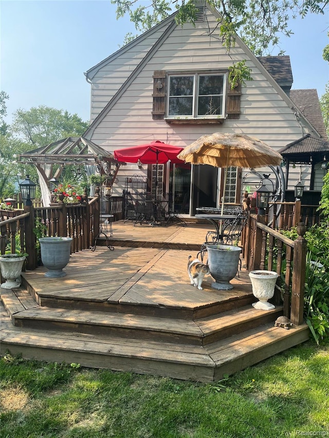 1264 Brabbs St, Burton, MI 48509 - wooden deck featuring outdoor dining area