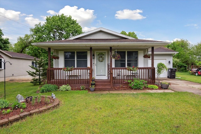 113 Diversy Dr, Brooklyn, MI 49230 - view of front of house with a garage, concrete driveway, a porch, and a front lawn