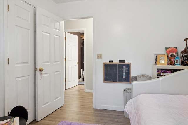 113 Diversy Dr, Brooklyn, MI 49230 - bedroom featuring wood finished floors and baseboards